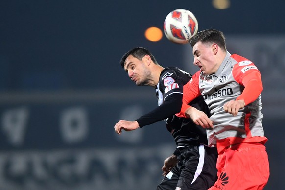 Lugano&#039;s player Miroslav Covilo left, fights for the ball with Young Boys&#039;s player Cedric Zesiger right, during the Super League soccer match FC Lugano against BSC Young Boys, at the Cornare ...