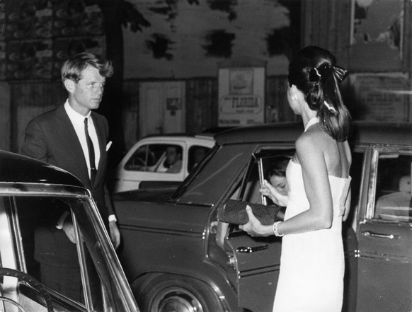 Senator Robert Kennedy with his wife. Via Veneto. Rome. 1966.