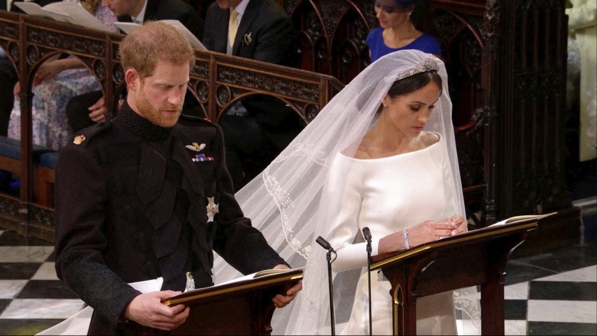 In this frame from video, Britain's Prince Harry and Meghan Markle pray during their wedding ceremony at St. George's Chapel in Windsor Castle in Windsor, near London, England, Saturday, May ...