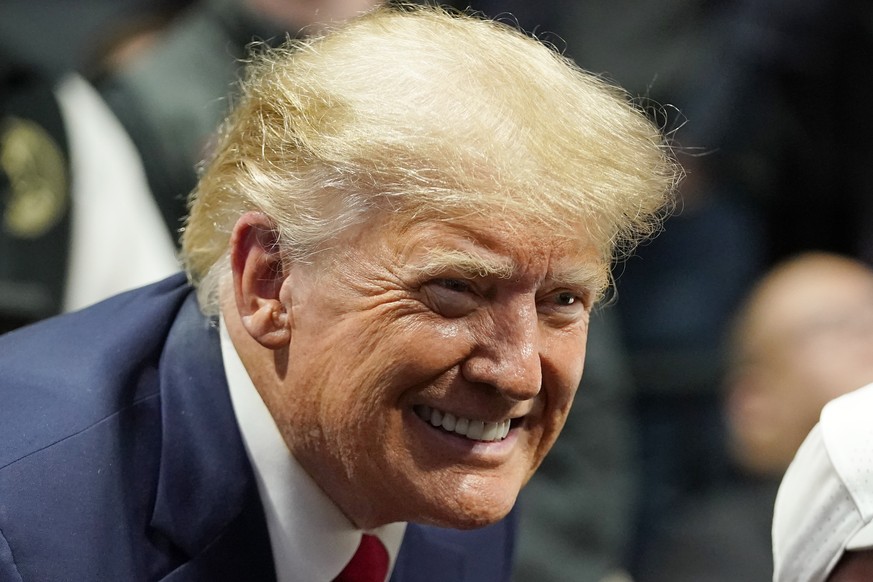 Former President Donald J. Trump smiles as he poses for a photo at the NCAA Wrestling Championships, Saturday, March 18, 2023, in Tulsa, Okla. (AP Photo/Sue Ogrocki) Donald J. Trump