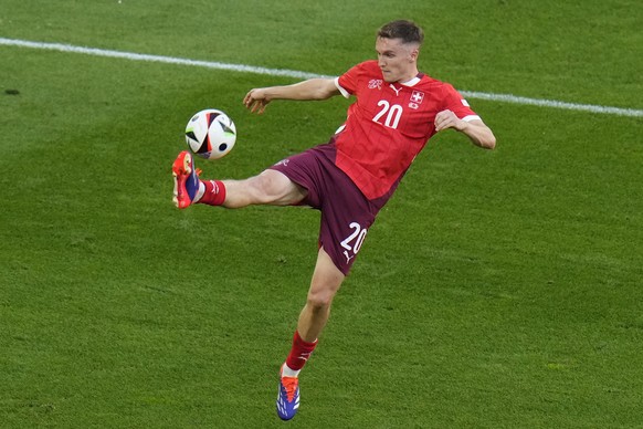 Switzerland&#039;s Michel Aebischer controls the ball during a quarterfinal match between England and Switzerland at the Euro 2024 soccer tournament in Duesseldorf, Germany, Saturday, July 6, 2024. (A ...