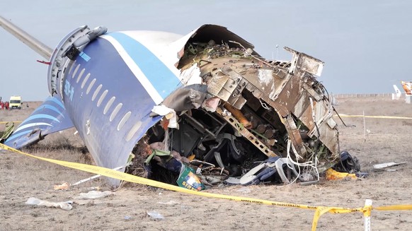 In this photo taken from a video released by the administration of Mangystau region, the wreckage of Azerbaijan Airlines Embraer 190 lies on the ground near the airport of Aktau, Kazakhstan, Wednesday ...