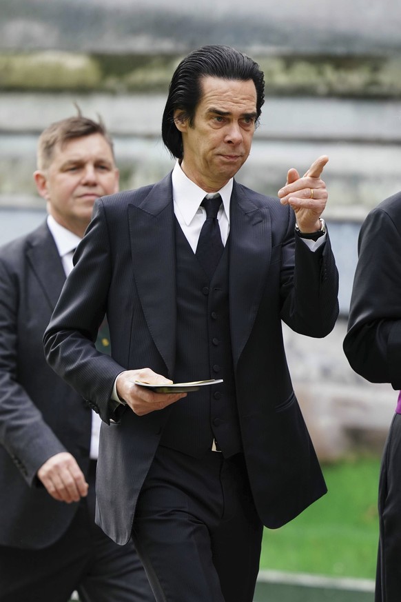 Nick Cave arrives ahead of the coronation ceremony of King Charles III at Westminster Abbey in London, Saturday May 6, 2023. (Jane Barlow/PA via AP)