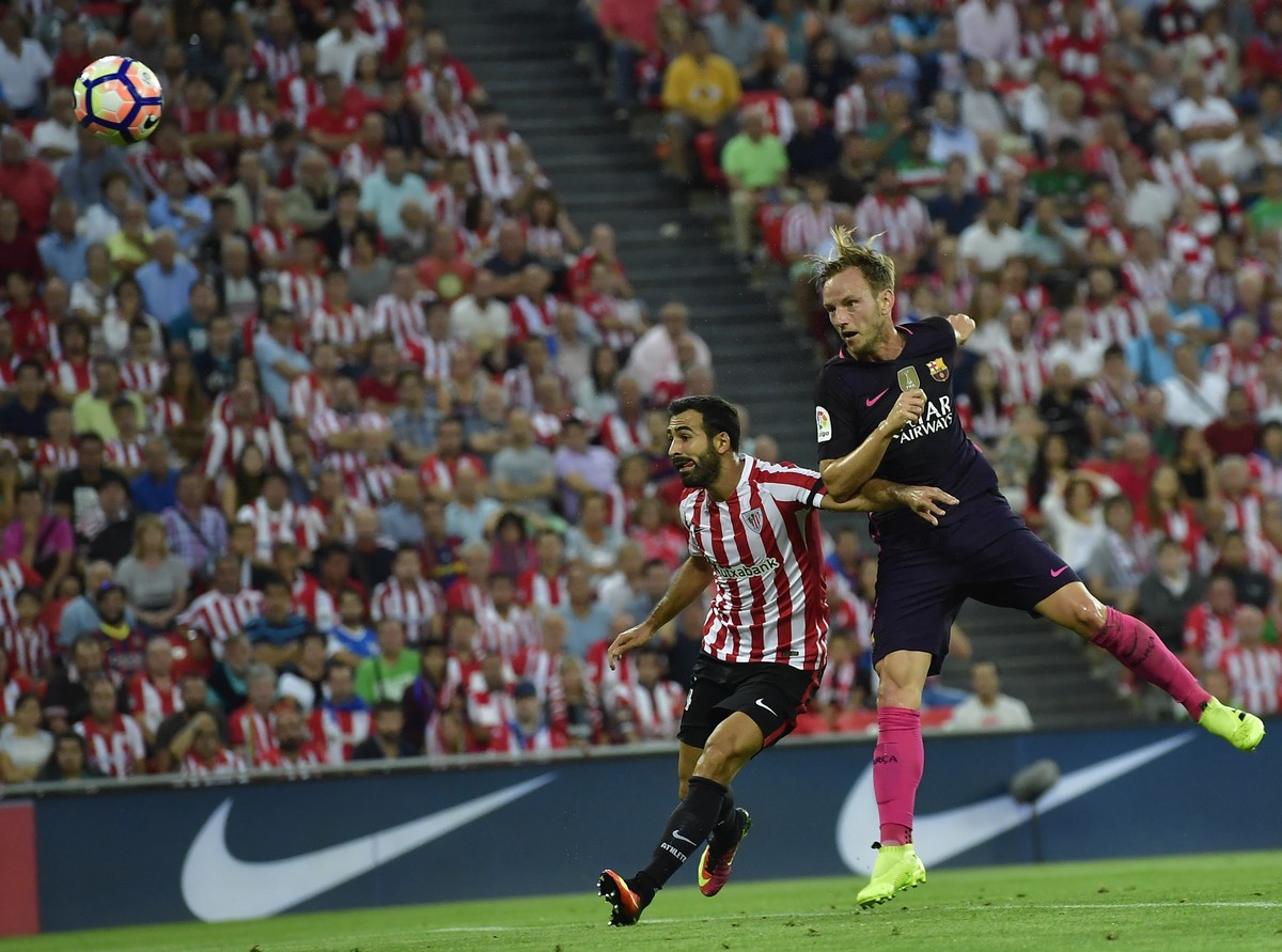 FC Barcelona's Ivan Rakitic, right, heads the ball to goal beside Athletic Bilbao's Mikel Balenziaga, during the Spanish La Liga soccer match between FC Barcelona and Athletic Bilbao, at San ...