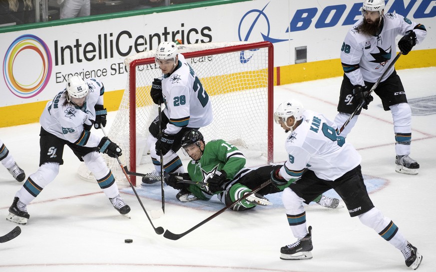San Jose Sharks defenseman Erik Karlsson (65), of Sweden; Timo Meier (28), of Switzerland; Evander Kane (9),;and Brent Burns (88) defend their open net as Dallas Stars left wing Blake Comeau (15) lies ...