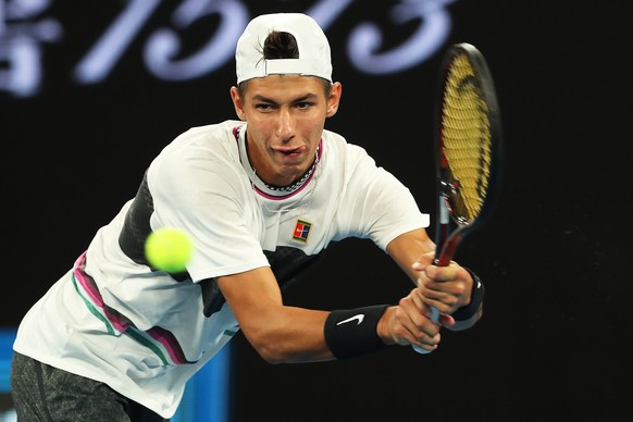 epa07292033 Alexei Popyrin of Australia in action against Dominic Thiem of Austria during their men&#039;s second round match of the Australian Open Grand Slam tennis tournament in Melbourne, Australi ...