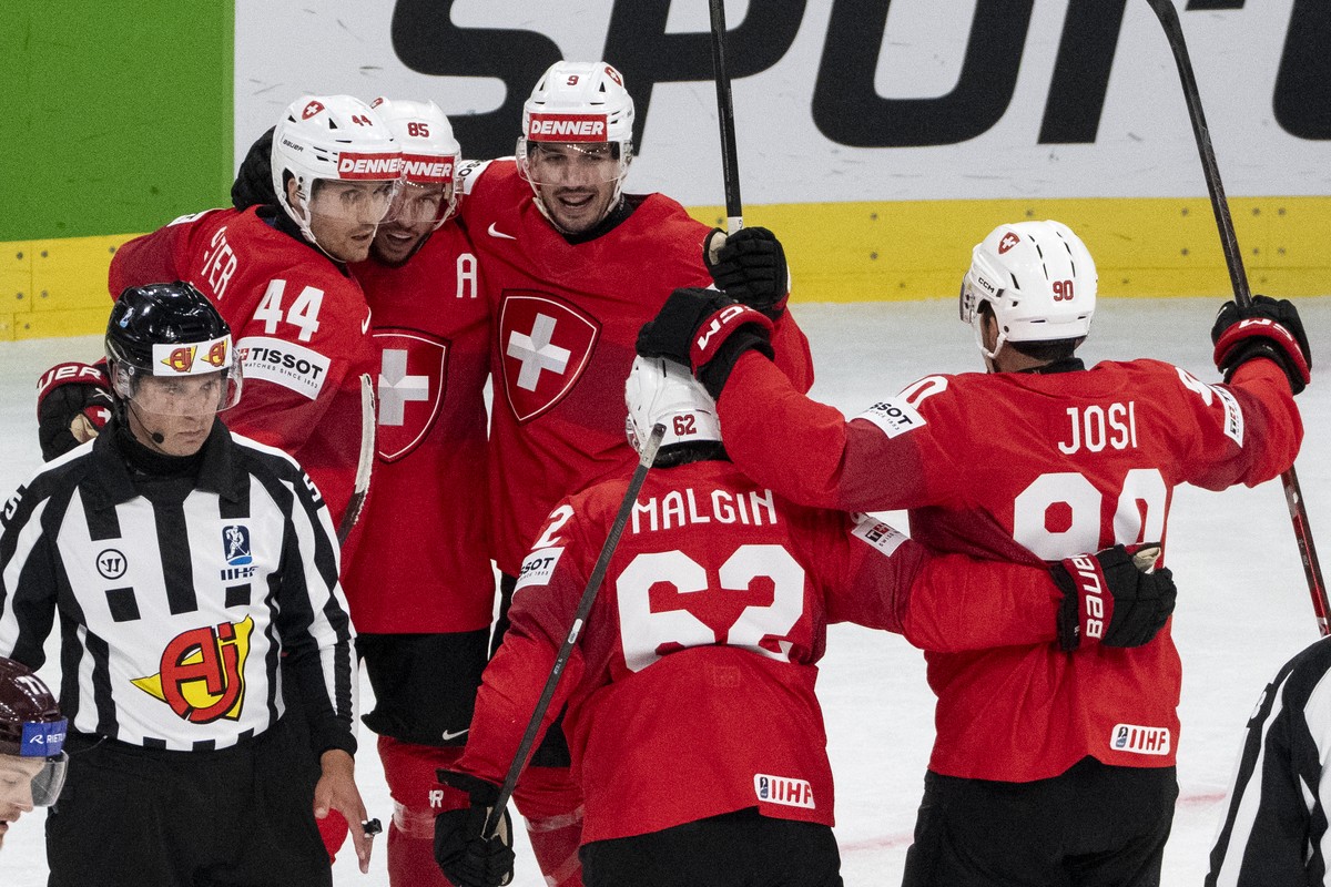 From left: Switzerland's Pius Suter, Switzerland's Sven Andrighetto, Switzerland's Damien Riat, Switzerland's Denis Malgin and Switzerland's Roman Josicelebrate after scoring  ...