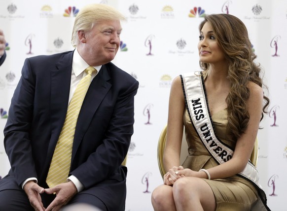 Donald Trump, left, and Miss Universe, Gabriela Isler, of Venezuela, talk during a news conference, Thursday, Oct. 2, 2014, in Doral, Fla. Three of the last six Miss Universe titles have gone to Venez ...