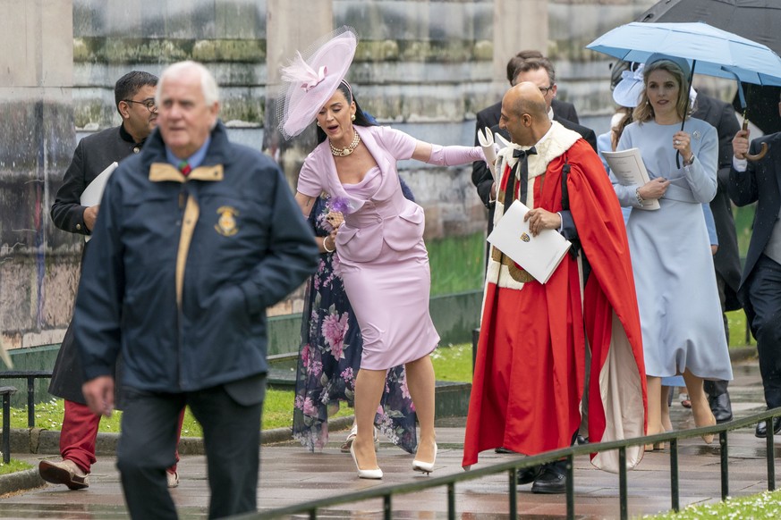 US singer Katy Perry, center, leaves Westminster Abbey following the coronation ceremony of King Charles III and Queen Camilla in London, Saturday, May 6, 2023. (Jane Barlow/Pool Photo via AP)