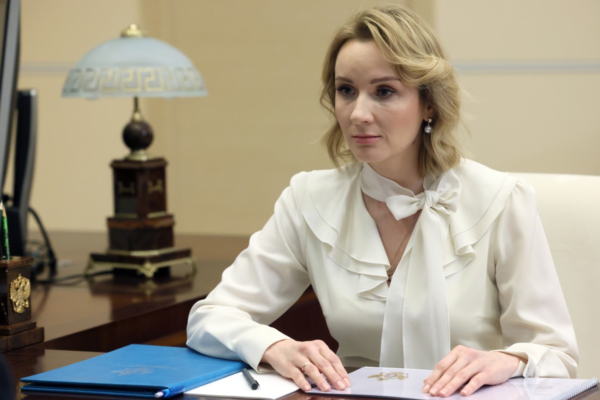 FILE - Russian Presidential Commissioner for Children's Rights Maria Lvova-Belova speaks to Russian President Vladimir Putin at the Novo-Ogaryovo state residence, outside Moscow, Russia, on Feb.  ...
