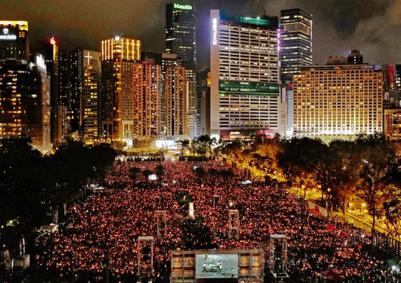 FILE - Thousands of people attend a candlelight vigil for victims of the Chinese government's brutal military crackdown three decades ago on protesters in Beijing's Tiananmen Square at Victo ...