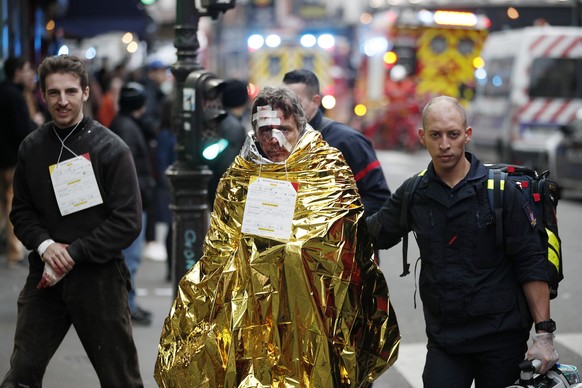 epa07276995 Emergency peronnel help injured persons at the scene of an explosion at a bakery near Rue de Trevise in Paris, France, 12 January 2019. According to police, a suspected gas leak has lead t ...