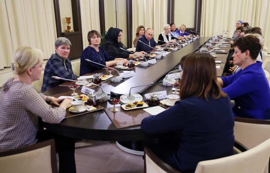 Russian President Vladimir Putin meets with mothers of military personnel serving in the special military operation ahead of Mother's Day at the Novo-Ogaryovo residence outside Moscow, Russia, Friday, ...