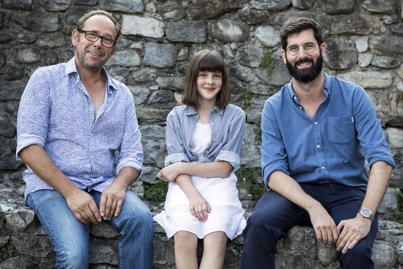 From left, Belgian actor Olivier Gourmet, Swiss actress Adele Bochatay and Swiss director Antoine Russbach pose during a photocall for the film &quot;Ceux qui travaillent&quot; at the 71st Locarno Int ...