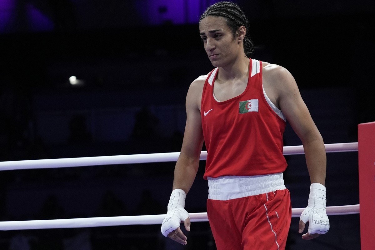 Algeria's Imane Khelif, reacts after defeating Italy's Angela Carini in their women's 66kg preliminary boxing match at the 2024 Summer Olympics, Thursday, Aug. 1, 2024, in Paris, France ...