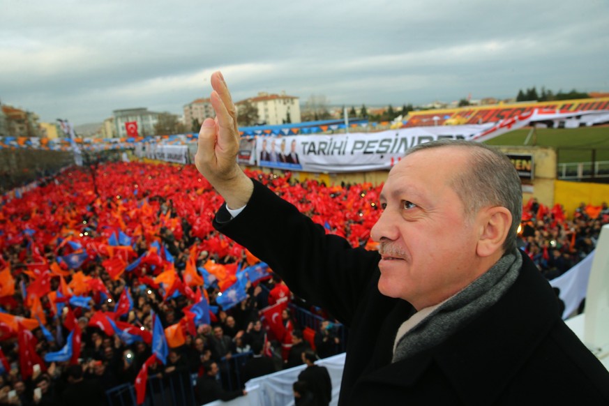 epa06457666 A handout photo made available by the Turkish President Press office shows Turkish President Recep Tayyip Erdogan speaking to his supporters in Usak city, Turkey, 20 January 2018. EPA/TURK ...