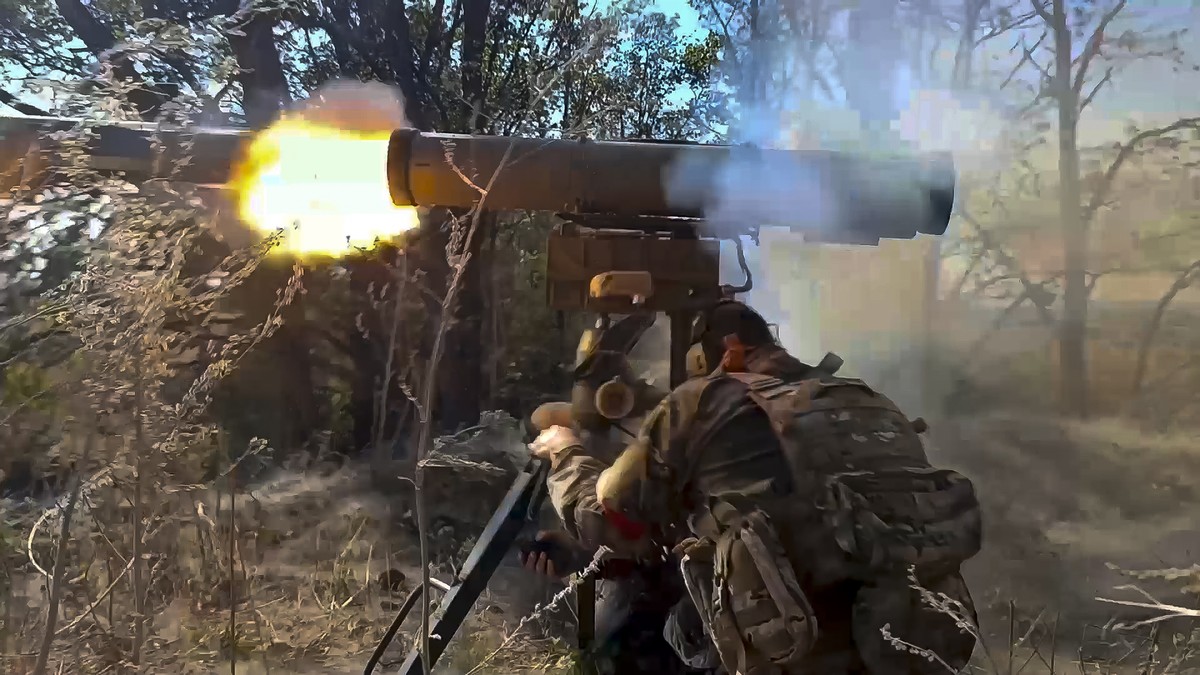 In this image made from video released by the Russian Defense Ministry on Tuesday, Sept. 24, 2024, a Russian soldier in an undisclosed location fires an anti-tank missile at Ukrainian forces. (Russian ...