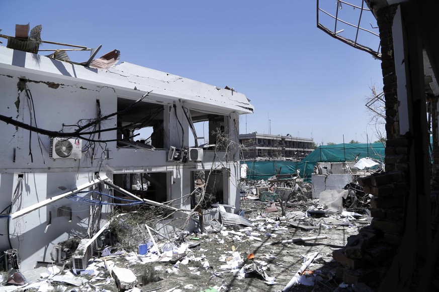 epa06002716 A view of destruction a day after a suicide bomb attack near foreign embassies in Kabul, Afghanistan, 01 June 2017. At least 90 people were killed and more than 350 were wounded in a suici ...