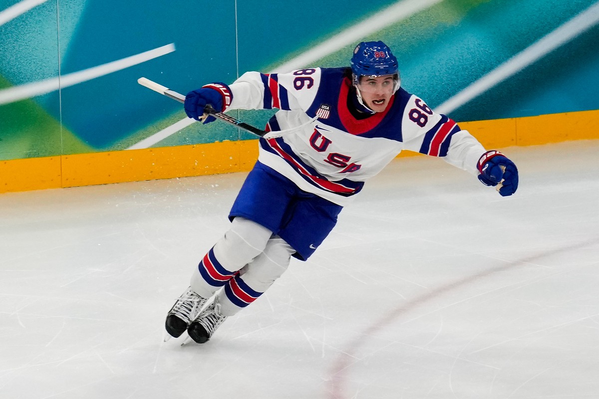 United States' Jack Hughes (86) reacts after scoring the winning goal in sudden death overtime against Canada during the men's ice hockey gold medal game at the 2026 Winter Olympics, in Mila ...