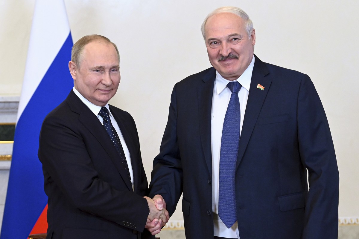 Russian President Vladimir Putin, left, and Belarusian President Alexander Lukashenko shake hands during their meeting in St. Petersburg, Russia, Saturday, June 25, 2022. (Maxim Blinov, Sputnik, Kreml ...