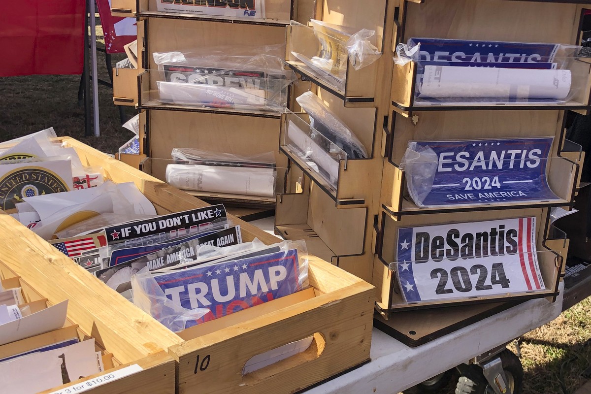 Bumper stickers supporting Florida Gov. Ron DeSantis on sale at former President Donald Trump's rally in Conroe, Texas, Saturday, Jan. 29, 2022. At Trump���s rally, there were signs of change. Ne ...