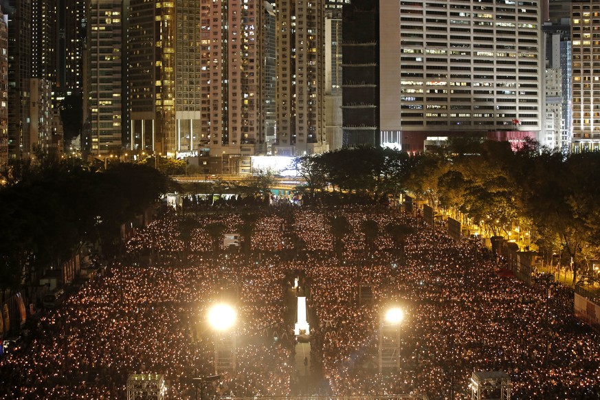 Tens of thousands of people attend an annual candlelight vigil at Hong Kong&#039;s Victoria Park, Monday, June 4, 2018. Hong Kongers commemorate victims of the Chinese government&#039;s brutal militar ...