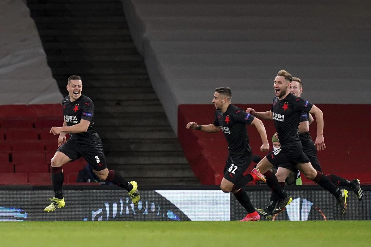 Slavia Prague's Tomas Holes, left, celebrates after scoring his side's first goal during the Europa League quarterfinal soccer match between Arsenal and Slavia Prague at Emirates stadium in  ...