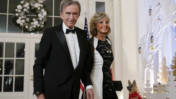 Bernard Arnault, Chairman and CEO of LVMH Moët Hennessy, and his wife Helene Mercier-Arnault arrive for the state dinner with President Joe Biden and French President Emmanuel Macron at the White House…