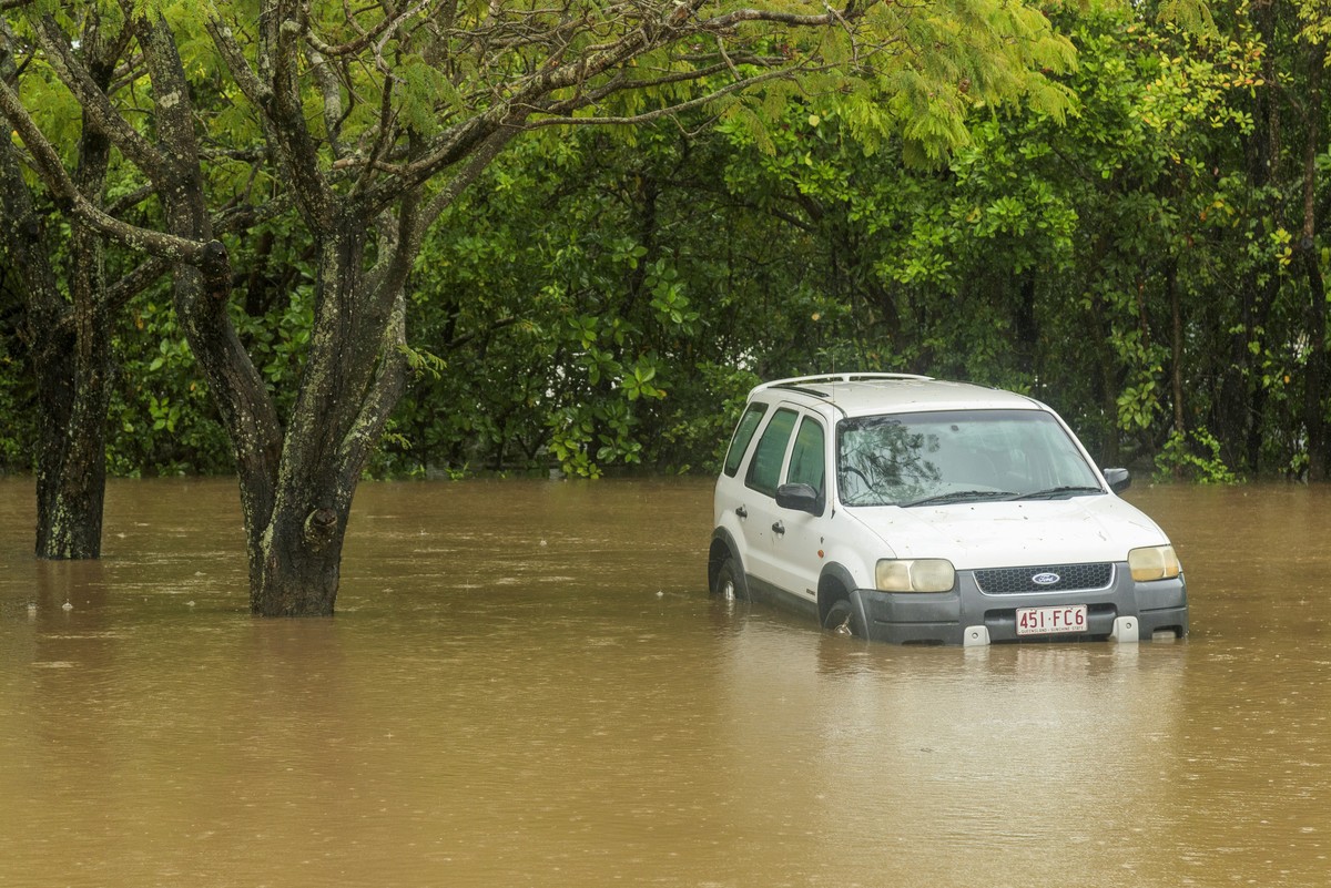 A car inundated with water near the Barron River in Cairns, Australia, Saturday, Dec. 16, 2023. Officials said Monday that more than 300 people have been rescued from floodwaters in northeast Australi ...