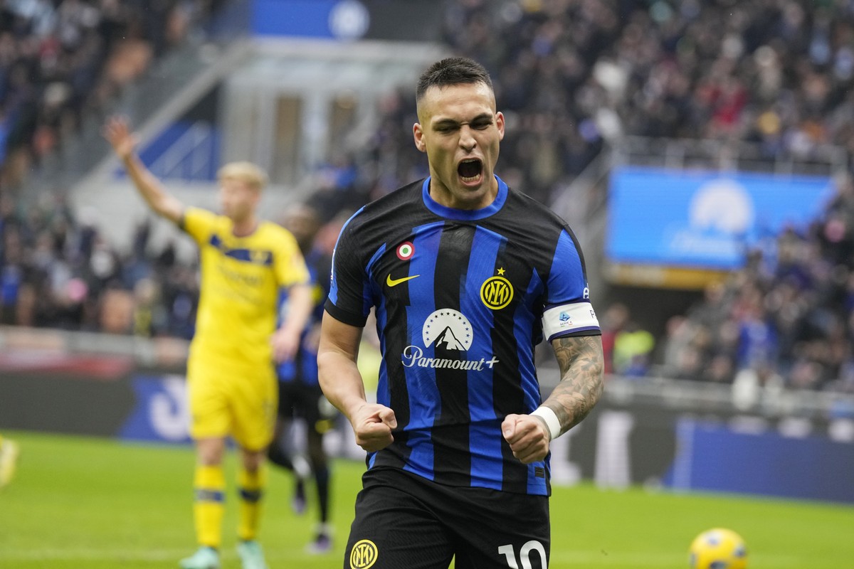 Inter Milan's Lautaro Martinez celebrates after scoring the opening goal during the Serie A soccer match between Inter Milan and Hellas Verona at the San Siro Stadium in Milan, Italy, Saturday, J ...