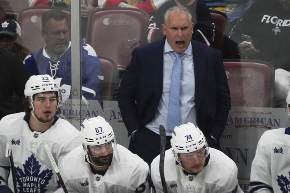 Toronto Maple Leafs head coach Craig Berube gestures during overtime in Game 3 of a second-round NHL hockey playoff series against the Florida Panthers, Friday, May 9, 2025, in Sunrise, Fla. (AP Photo ...