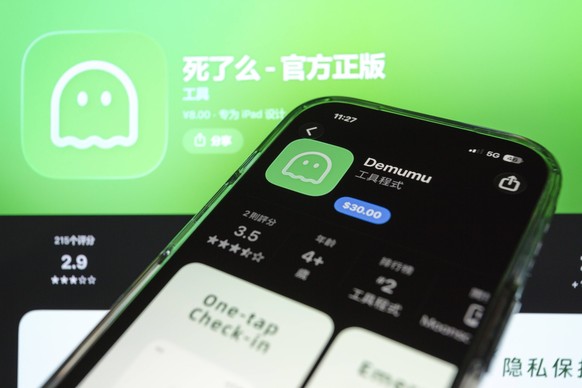 January 14, 2026, Taichung, Taiwan: App of Demumu, also known in Chinese as Are You Dead , a viral safety app from China designed for people living alone, is displayed on the App Store listing on iPho ...