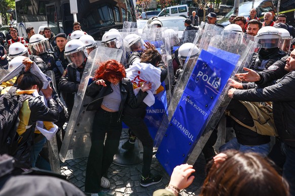 epa10601636 Turkish riot police clash with protesters as they try to reach Taksim Square for an unauthorized May Day celebration during an International Workers&#039; Day demonstration in Istanbul, Tu ...