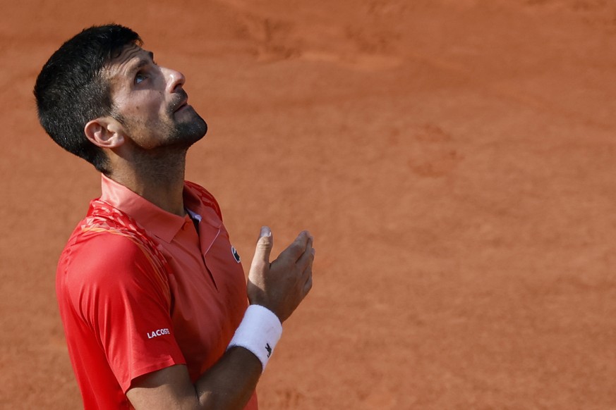 Serbia&#039;s Novak Djokovic celebrates winning his semifinal match of the French Open tennis tournament against Spain&#039;s Carlos Alcaraz in four sets, 6-3, 5-7, 6-1, 6-1, at the Roland Garros stad ...