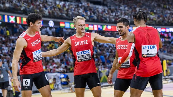 Enrico Guentert, Felix Svensson, Pascal Mancini and Bradley Lestrade of Switzerland react during the men&#039;s 4x100 meters relay qualification of the World Athletics Championships at the National At ...