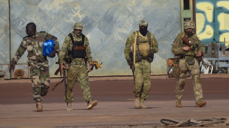 This undated photograph handed out by French military shows three Russian mercenaries, right, in northern Mali. Russia has engaged in under-the-radar military operations in at least half a dozen count ...