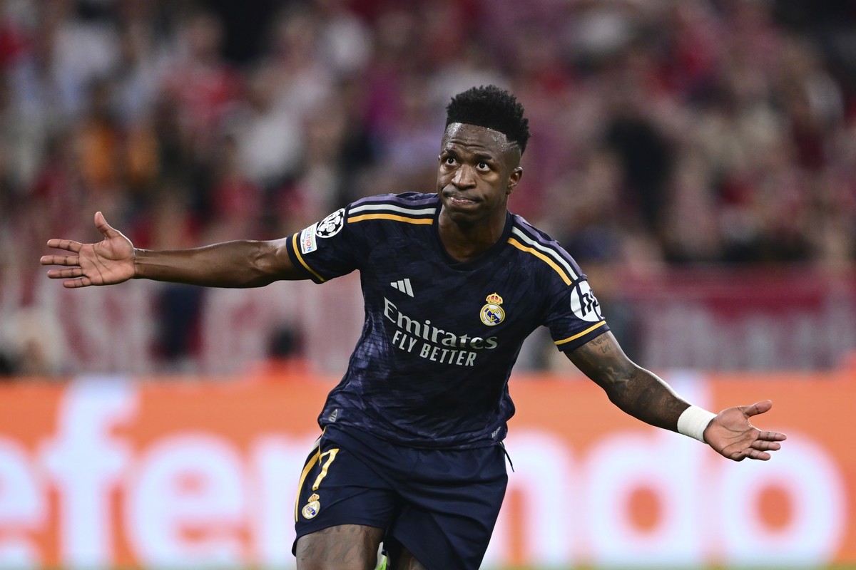 Real Madrid's Vinicius Junior celebrates after scoring his side's second goal on a penalty kick during the Champions League semifinal first leg soccer match between Bayern Munich and Real Ma ...