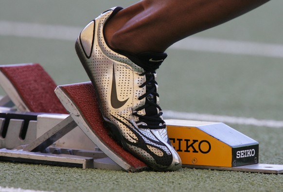 FILE - A Nike running shoe is seen in the starting block during the IAAF Athletics World Final in Stuttgart, southern Germany, in this Saturday, Sept 9, 2006, file photo. Ever since a track coach name ...