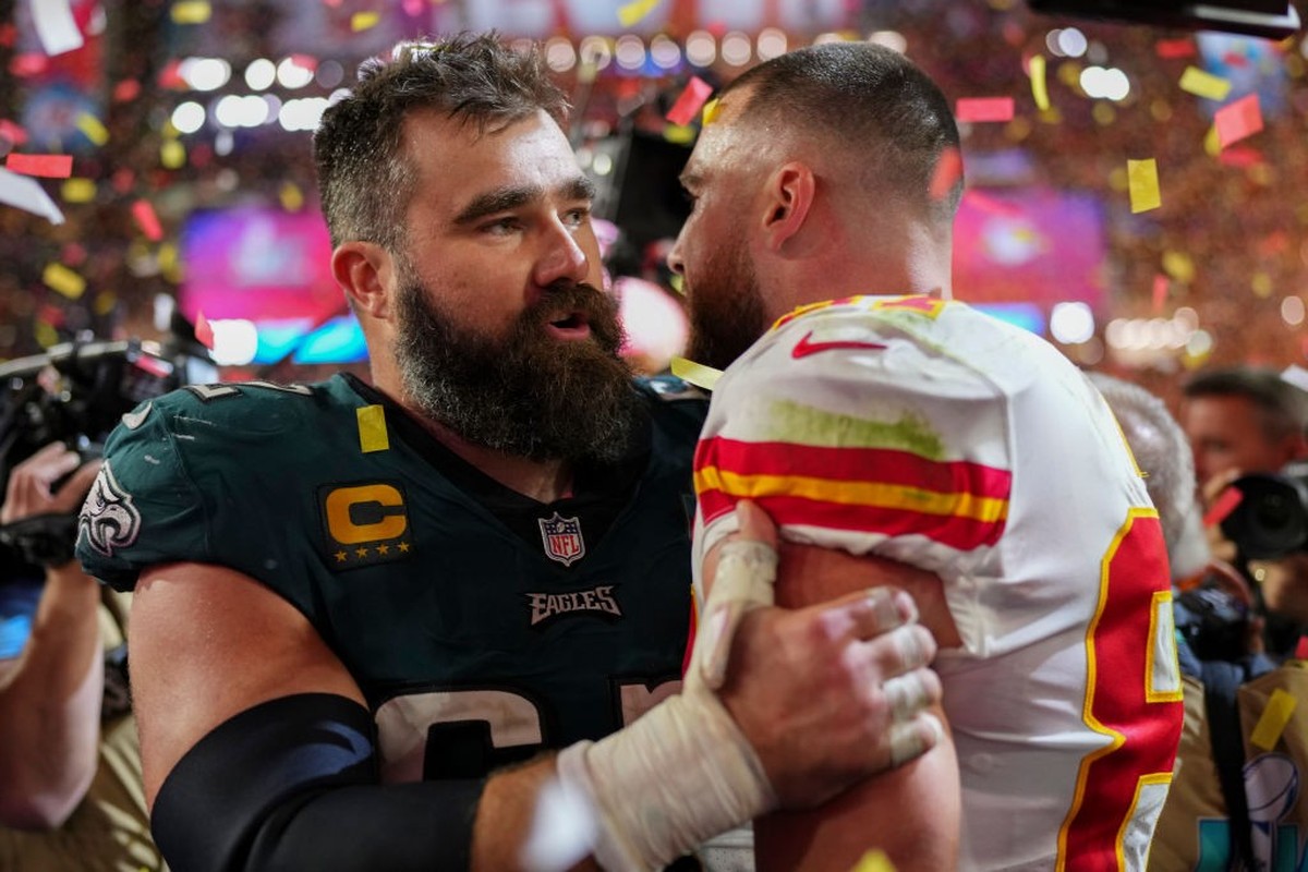 GLENDALE, AZ - FEBRUARY 12: Jason Kelce #62 of the Philadelphia Eagles speaks with Travis Kelce #87 of the Kansas City Chiefs after Super Bowl LVII at State Farm Stadium on February 12, 2023 in Glenda ...