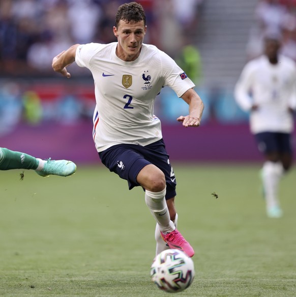 Hungary&#039;s Roland Sallai is airborne as he challenges for the ball with France&#039;s Benjamin Pavard during the Euro 2020 soccer championship group F match between Hungary and France, at the Fere ...