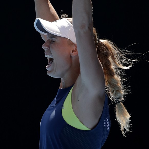 Denmark&#039;s Caroline Wozniacki celebrates after defeating Belgium&#039;s Elise Mertens in their semifinal at the Australian Open tennis championships in Melbourne, Australia, Thursday, Jan. 25, 201 ...