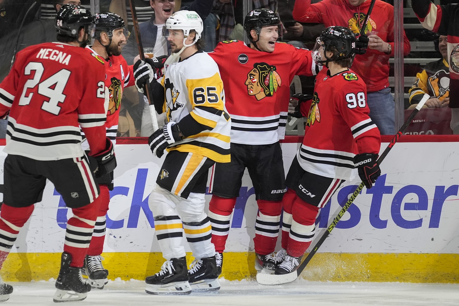 Chicago Blackhawks center Philipp Kurashev, second from right, celebrates his goal against the Pittsburgh Penguins with an assist by center Connor Bedard, right, during the second period of an NHL hoc ...