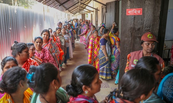 epa12731467 Bangladesh voter queue to cast their vote at the polling center during the 13th national general election at Narinda Government High school in Dhaka, Bangladesh, 12 February 2026. Voters a ...