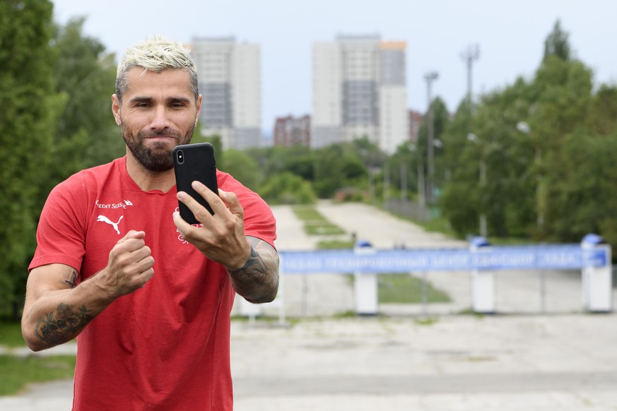 Switzerland&#039;s midfielder Valon Behrami takes a selfie after a training session of the Switzerland&#039;s national soccer team at the Torpedo Stadium, in Togliatti, Russia, Wednesday, June 13, 201 ...