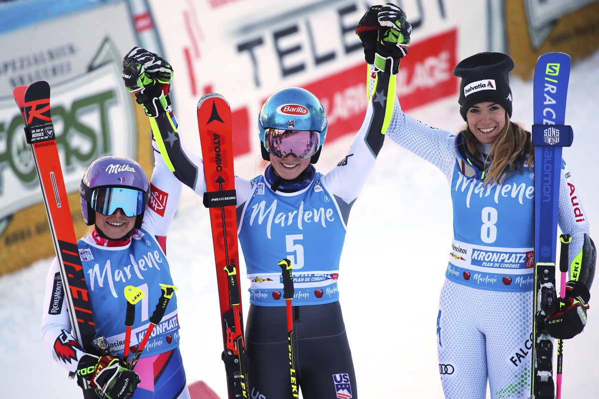 From left, second placed France's Tessa Worley, first placed United States' Mikaela Shiffrin and third placed Italy's Marta Bassino celebrate at the end of an alpine ski, women's W ...