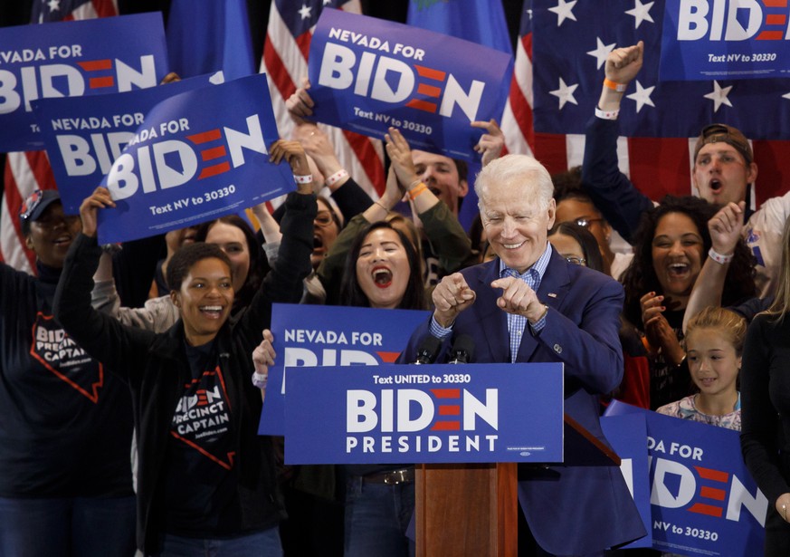 epaselect epa08239382 US Democratic presidential candidate, former Vice President Joe Biden (C, front), reacts as he addresses supporters during his Nevada post-caucus rally in Las Vegas, Nevada, USA, ...