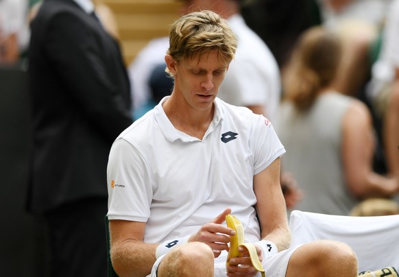 epa06886459 Kevin Anderson of South Africa plays John Isner of the US in their semi final match during the Wimbledon Championships at the All England Lawn Tennis Club, in London, Britain, 13 July 2018 ...