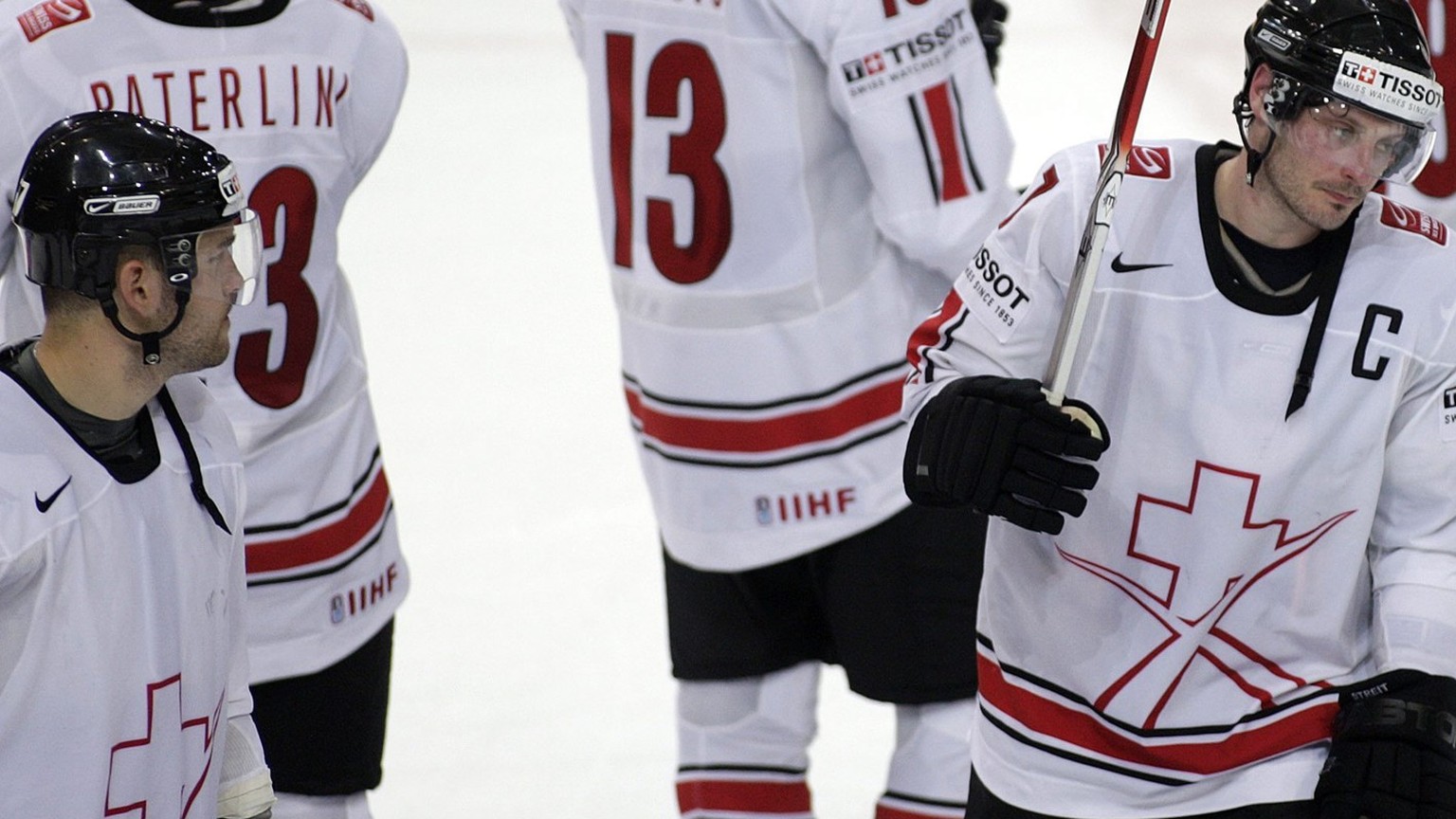 Switzerland's captain Mark Streit, 2nd left, and teammates show their disappointment after the game of the Group E Qualifying Round game between U.S.A. and Switzerland at the IIHF 2009 World Cham ...