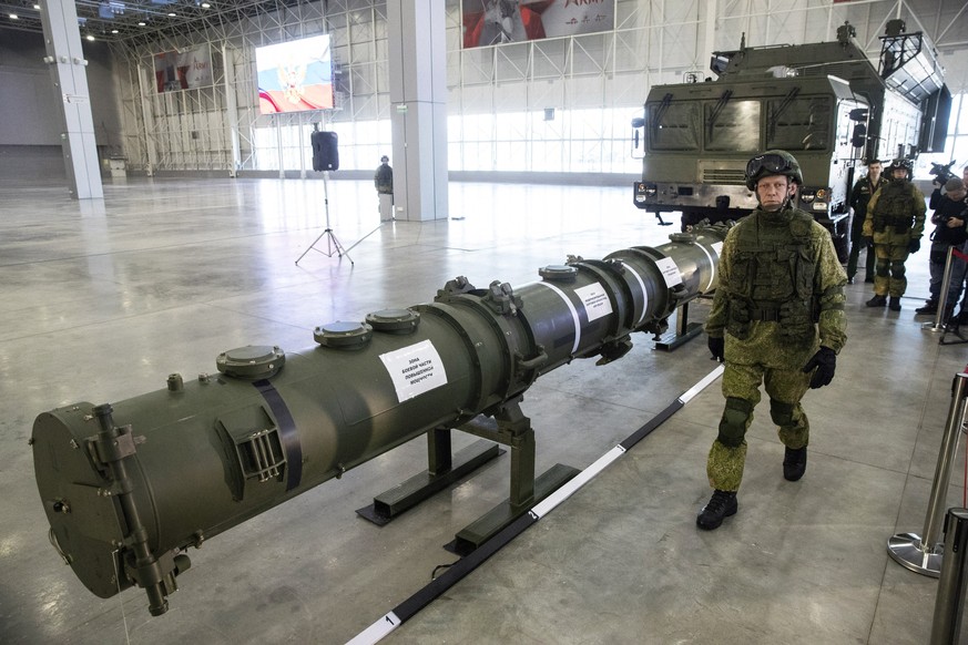 A Russian military officer walks past the 9M729 land-based cruise missile on display with its launcher, right, in Kubinka outside Moscow, Russia, Wednesday, Jan. 23, 2019. The Russian military on Wedn ...