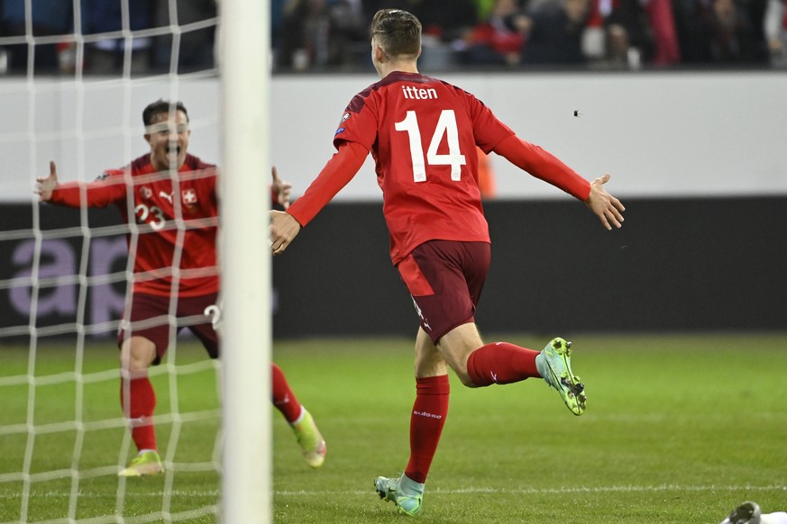 Switzerland&#039;s forward Cedric Itten, right, celebrates his goal after scoring the 3 - 0 with Switzerland&#039;s midfielder Xherdan Shaqiri, left, during the 2022 FIFA World Cup European Qualifying ...